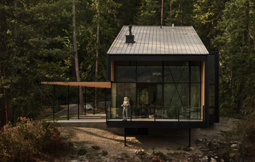 Summer Cabin on a rocky terrain with generous outdoor patios